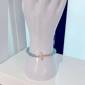Religious bracelet,
 crystal beads, turquoise colour 
with gold cross gold beads